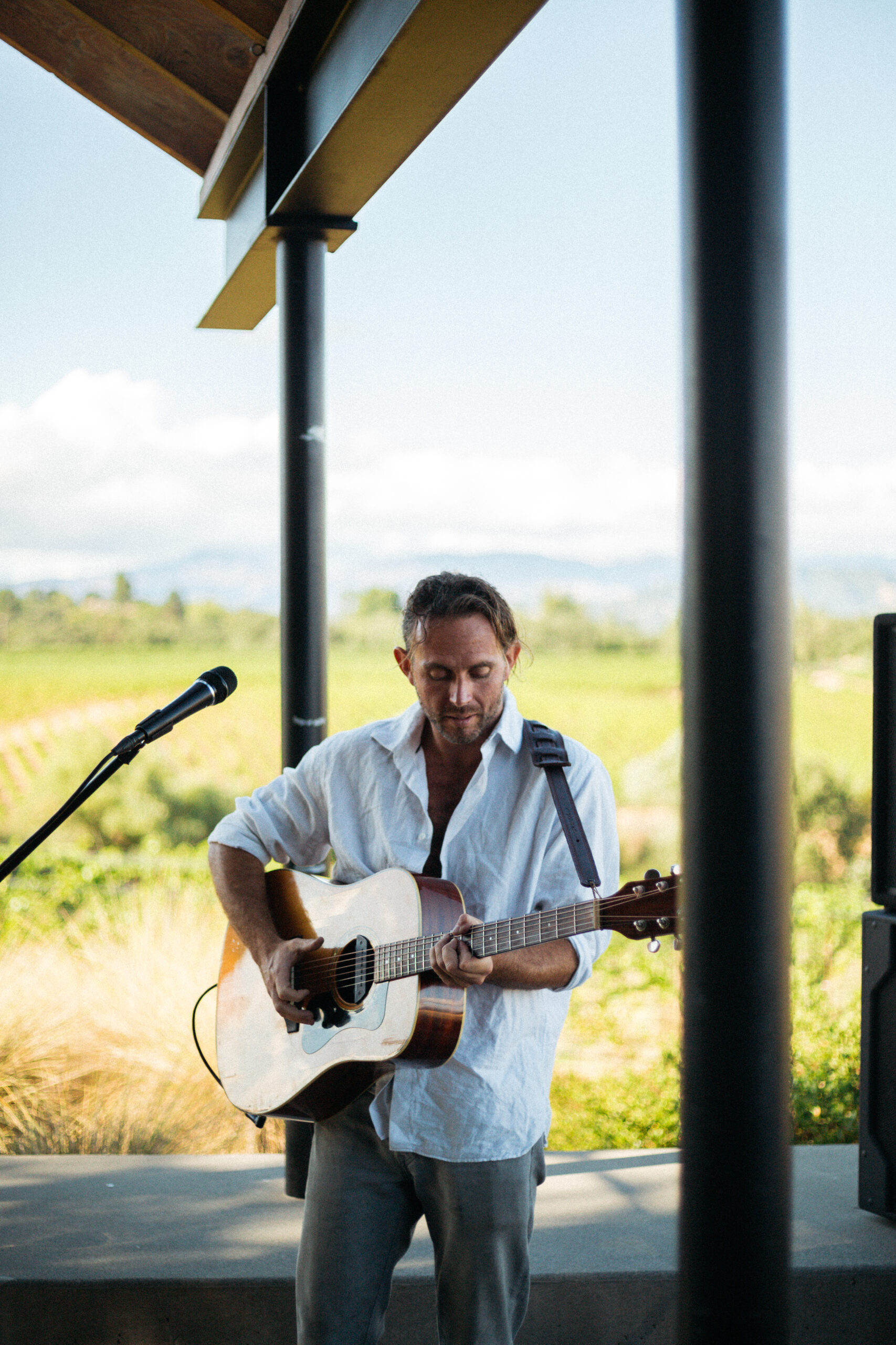 Man playing the guitar at the Estate House