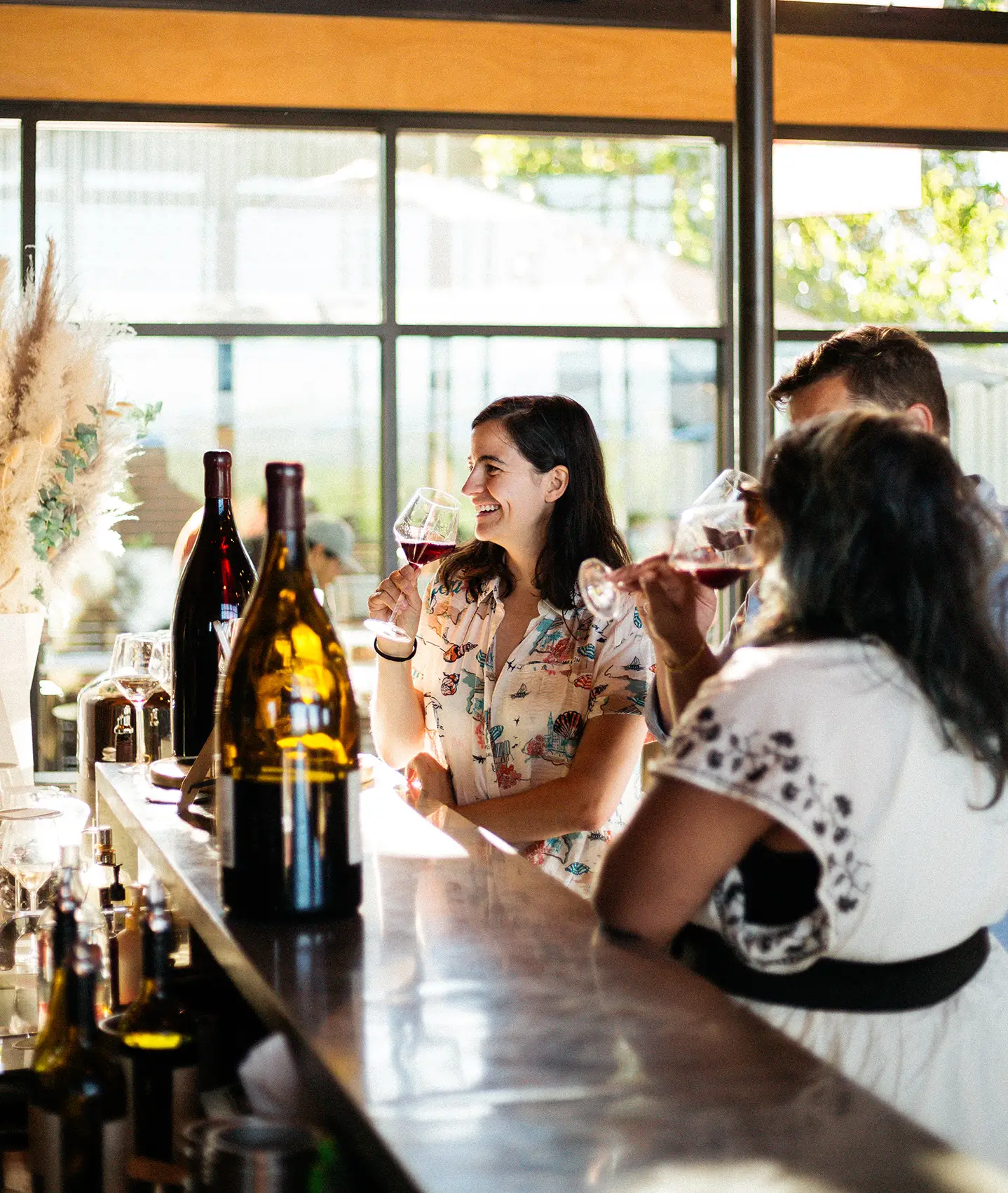 Person drinking wine at Estate House