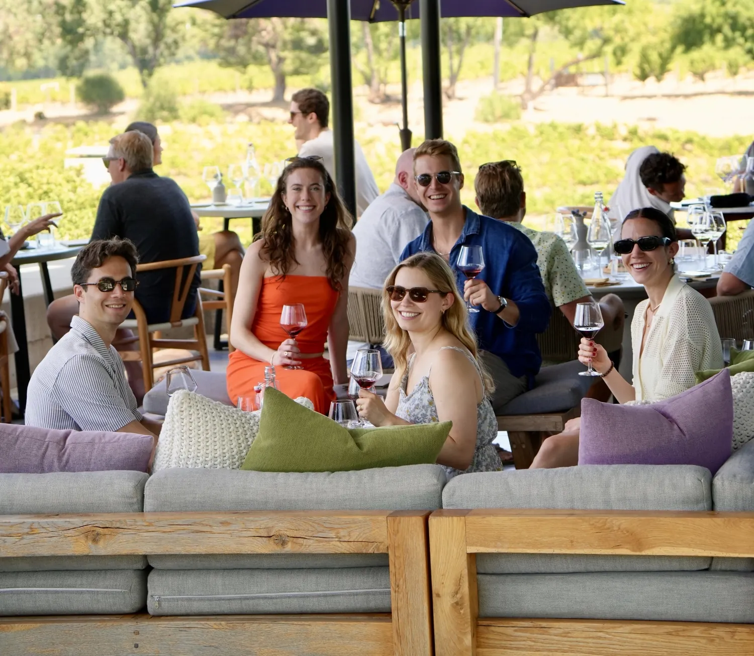 People sitting on the deck outside the MacRostie Estate House