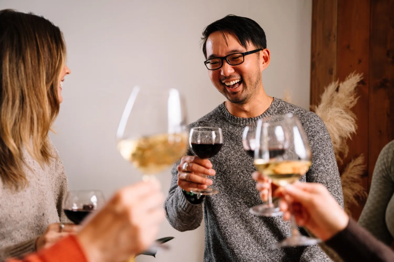 People holding glasses of wine