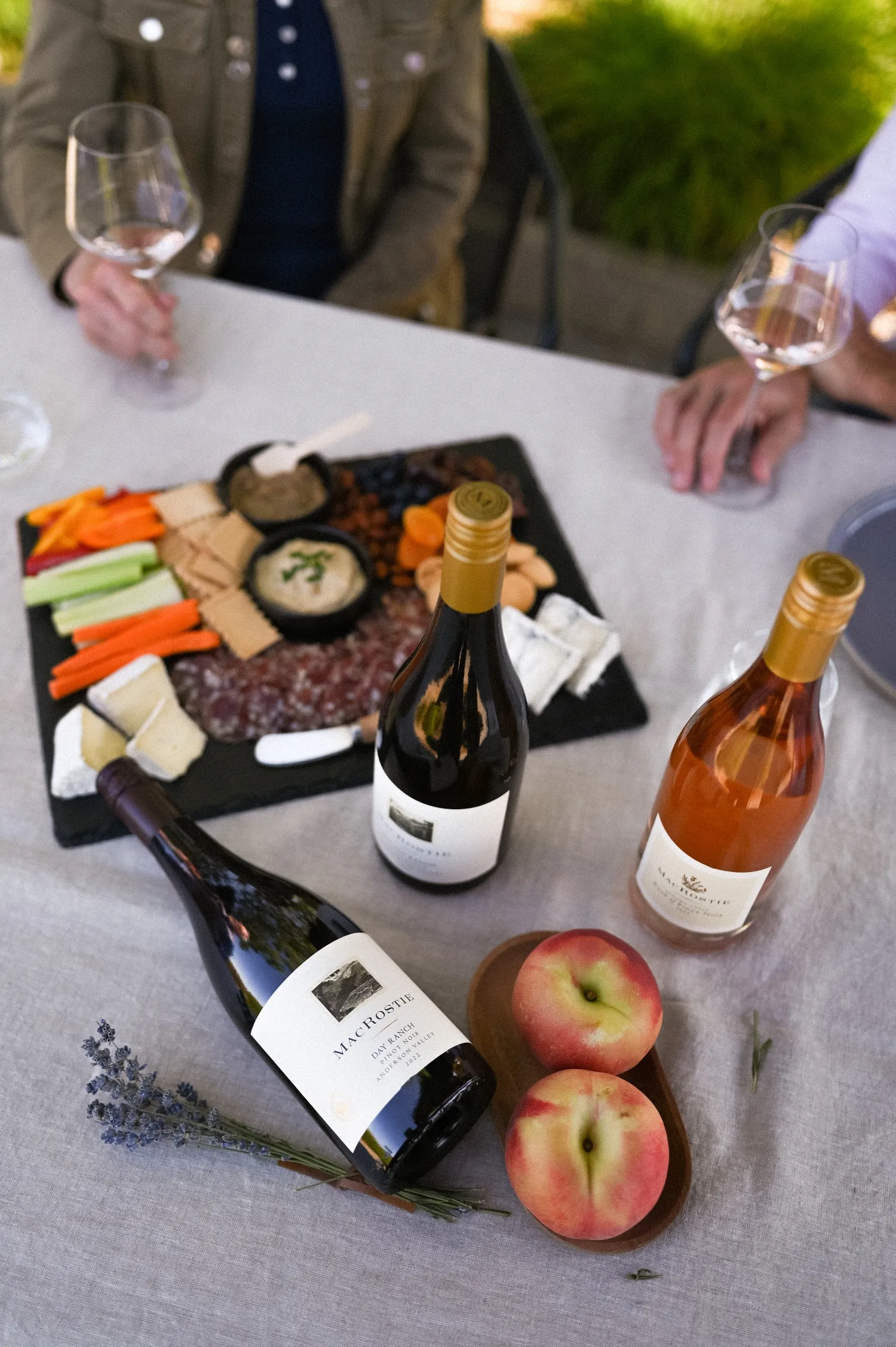 Bottles of MacRostie wine on a table with food pairings