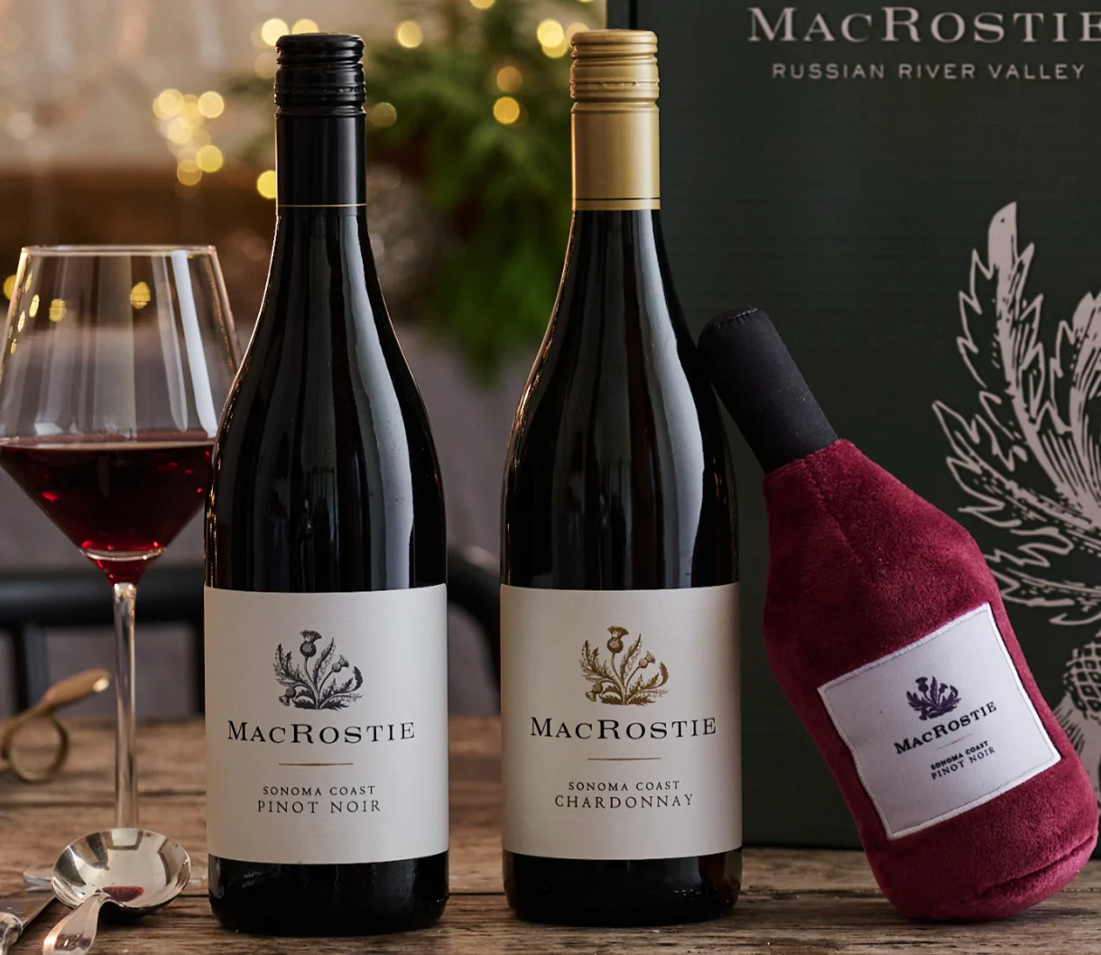 A wine gift set with a dog toy in a shape of a MacRostie wine bottle.