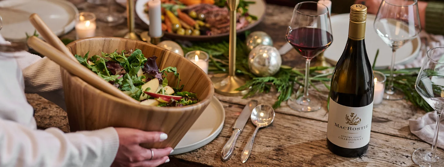 Bottle of MacRostie Sonoma Coast Chardonnay on a table with holiday decor
