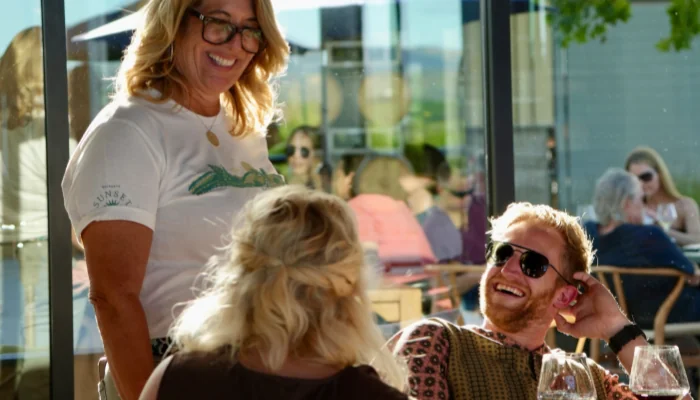 MacRostie ambassador talking to guests at the MacRostie Estate House